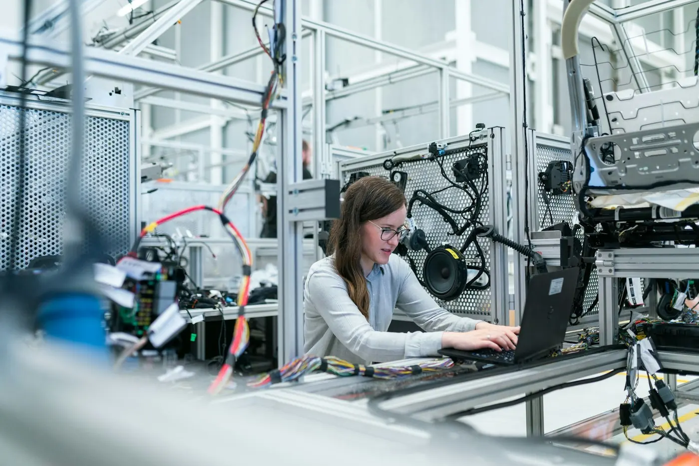 Student building a prototype in an engineering laboratory