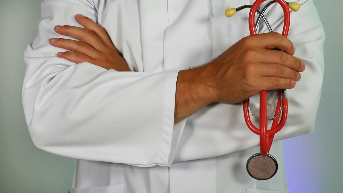 Medical professional in a white coat with a stethoscope, representing NEET preparation