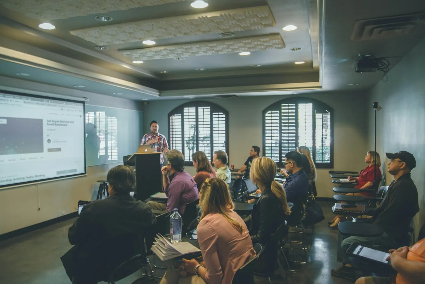 Audience watching a research presentation at a seminar